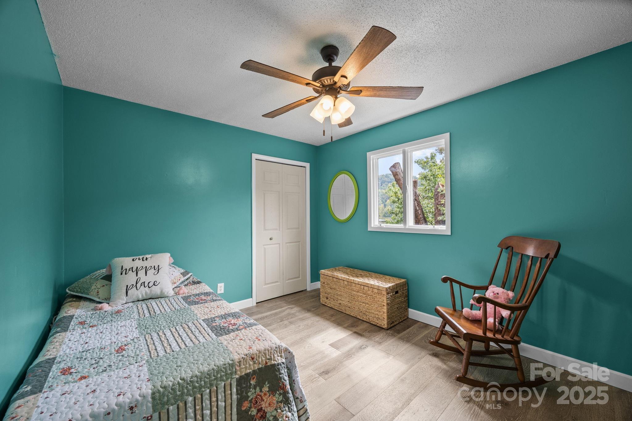 263 Morgan Branch Road Leicester, NC 28748 - Photo 26 of 31 a bedroom with a bed and a window