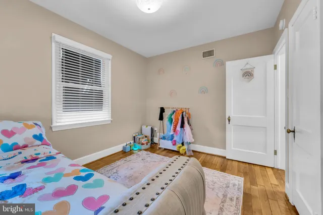 a bed room with a bed and a window