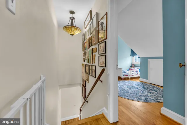 a living room with furniture rug and window
