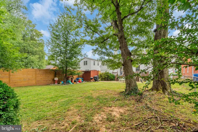 a view of a house with a yard porch and sitting area