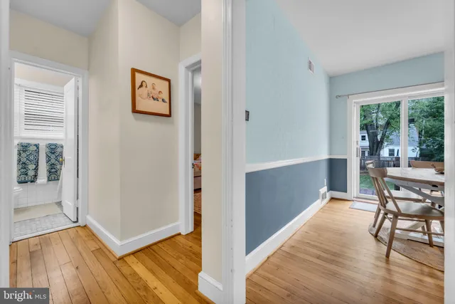 a view of a hardwood floor and an empty room