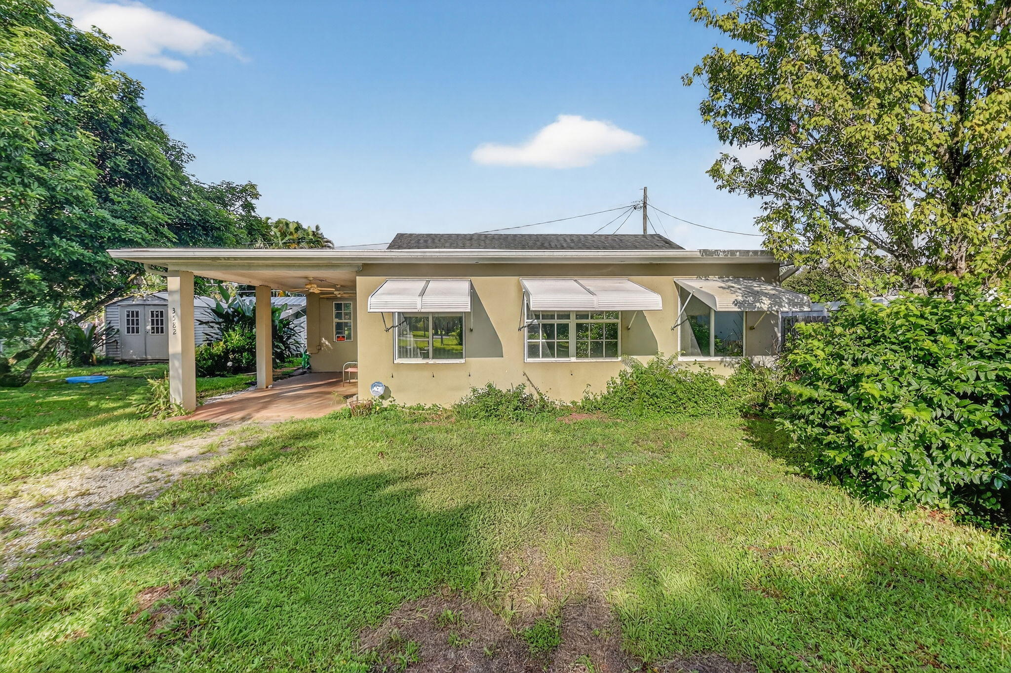 front view of a house with a yard