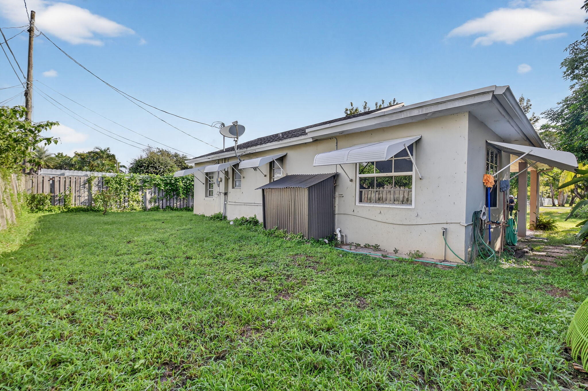 3582 Davis Road Palm Springs, FL 33461 - Photo 24 of 42 a view of a house with backyard