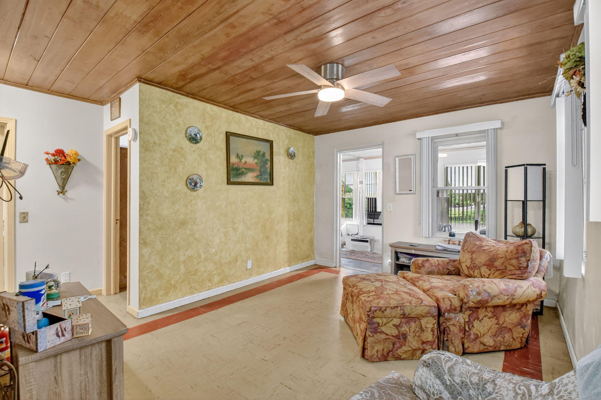 3582 Davis Road Palm Springs, FL 33461 - Photo 8 of 42 a living room with furniture and a large window