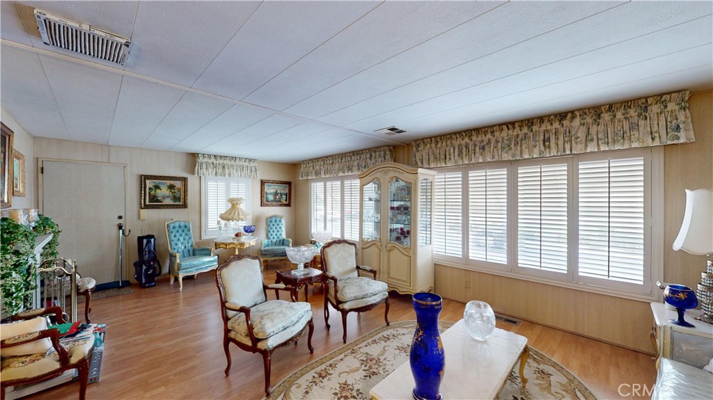 14851 Jeffrey Road, Unit 117 Irvine, CA 92618 - Photo 13 of 45 a living room with furniture and wooden floor