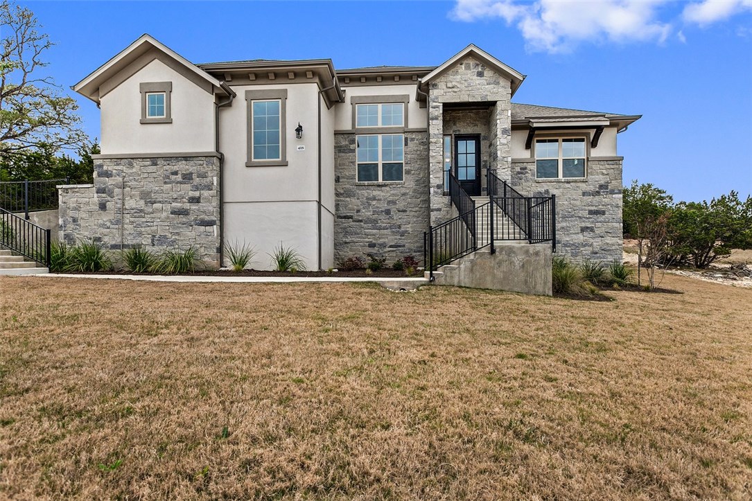 a front view of a house with a yard
