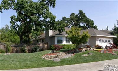 5987 Stone Bridge Road Santa Rosa, CA 95409 - Photo 1 of 1 a front view of a house with a garden and plants