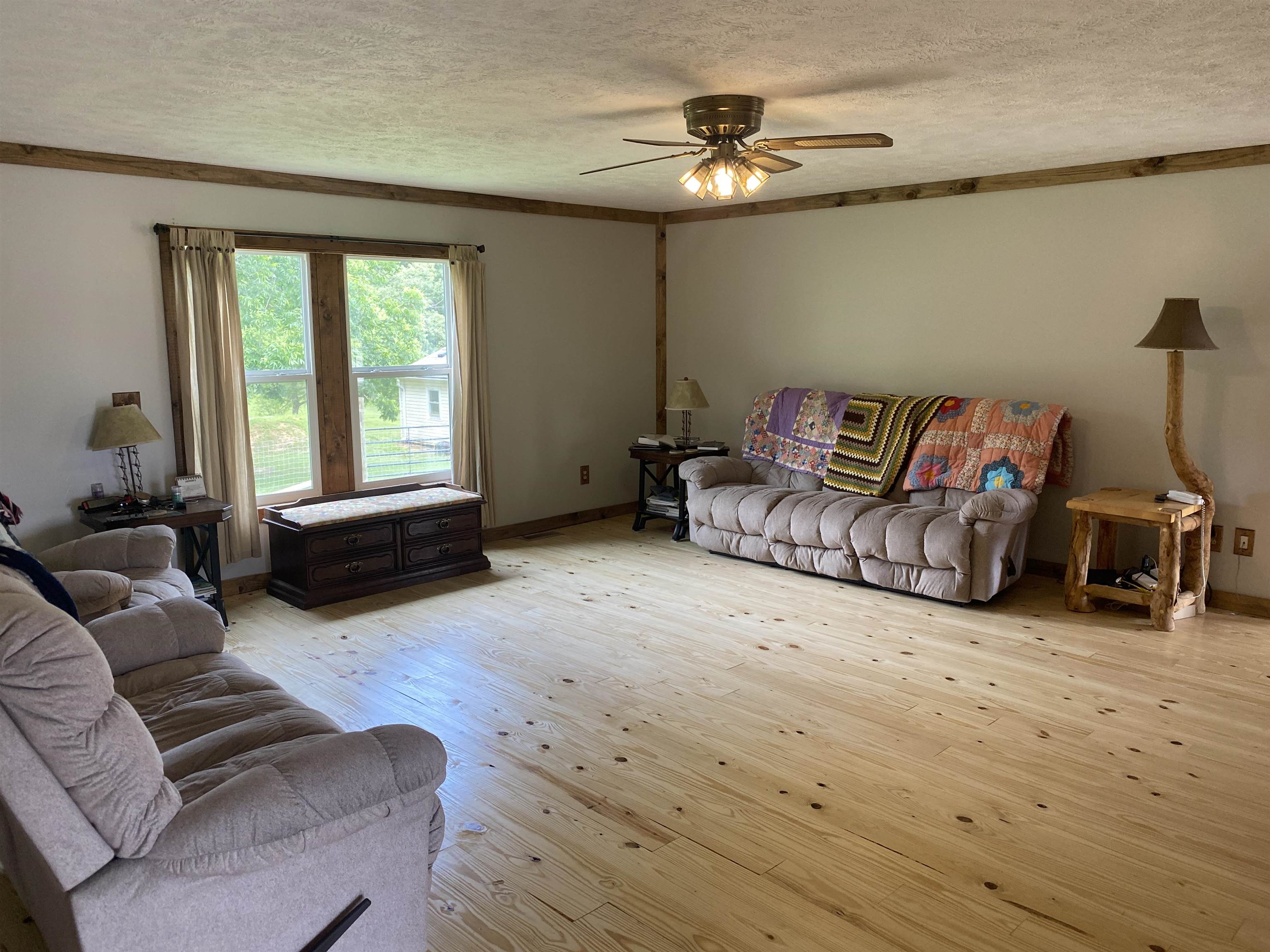 1120 Jot Em Down Road Morris Chapel, TN 38361 - Photo 32 of 40 a living room with furniture and a large window