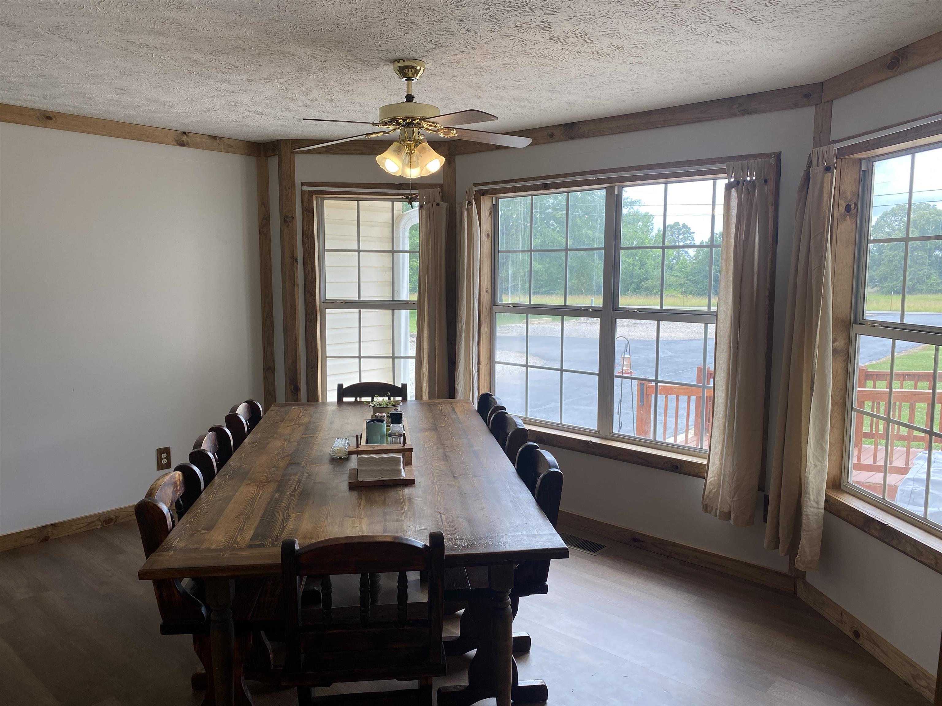 1120 Jot Em Down Road Morris Chapel, TN 38361 - Photo 35 of 40 a view of a dining room with furniture window and outside view