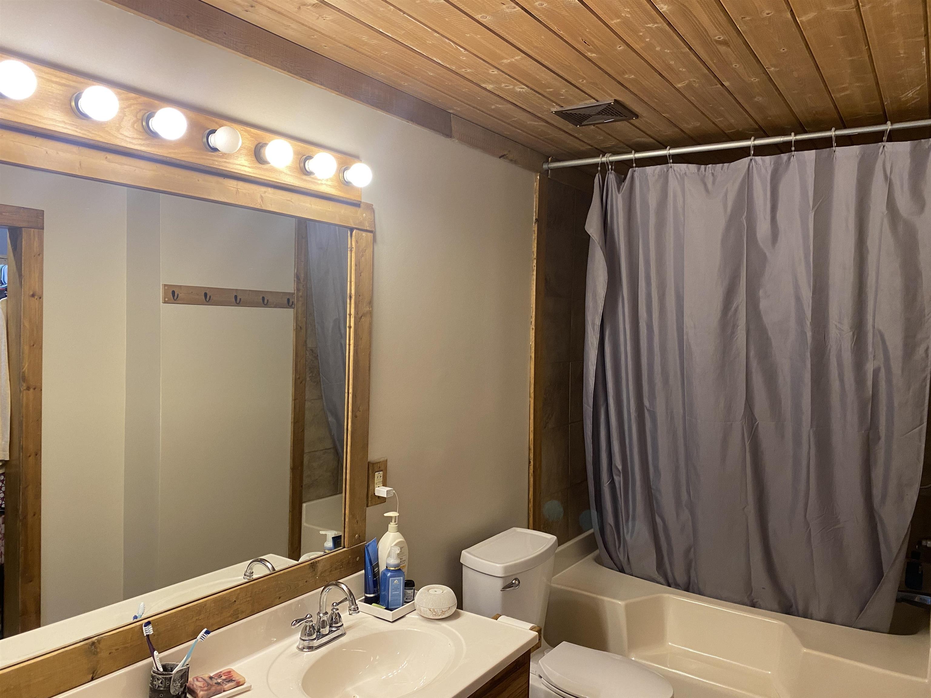 1120 Jot Em Down Road Morris Chapel, TN 38361 - Photo 7 of 40 a bathroom with a sink and a mirror