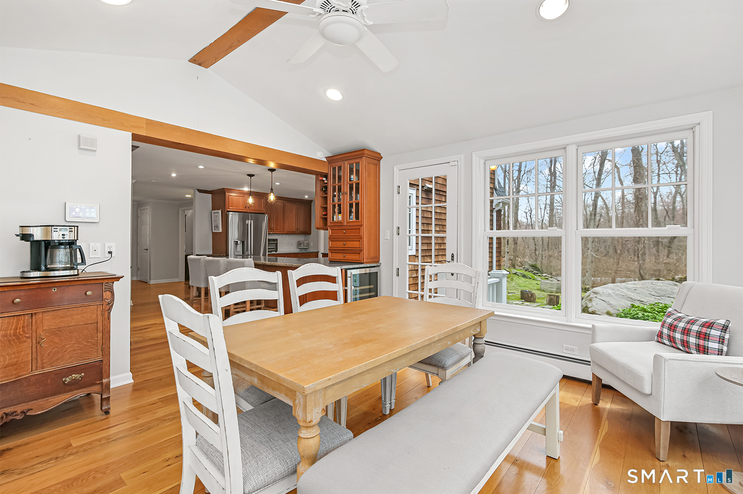 99 Chicken Street Wilton, CT 06897 - Photo 11 of 38 a view of a dining room with furniture window and wooden floor