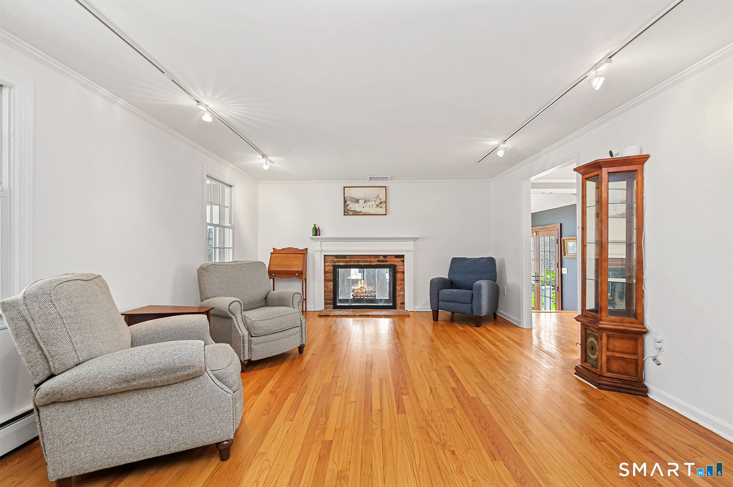 99 Chicken Street Wilton, CT 06897 - Photo 17 of 38 a living room with furniture and a fireplace