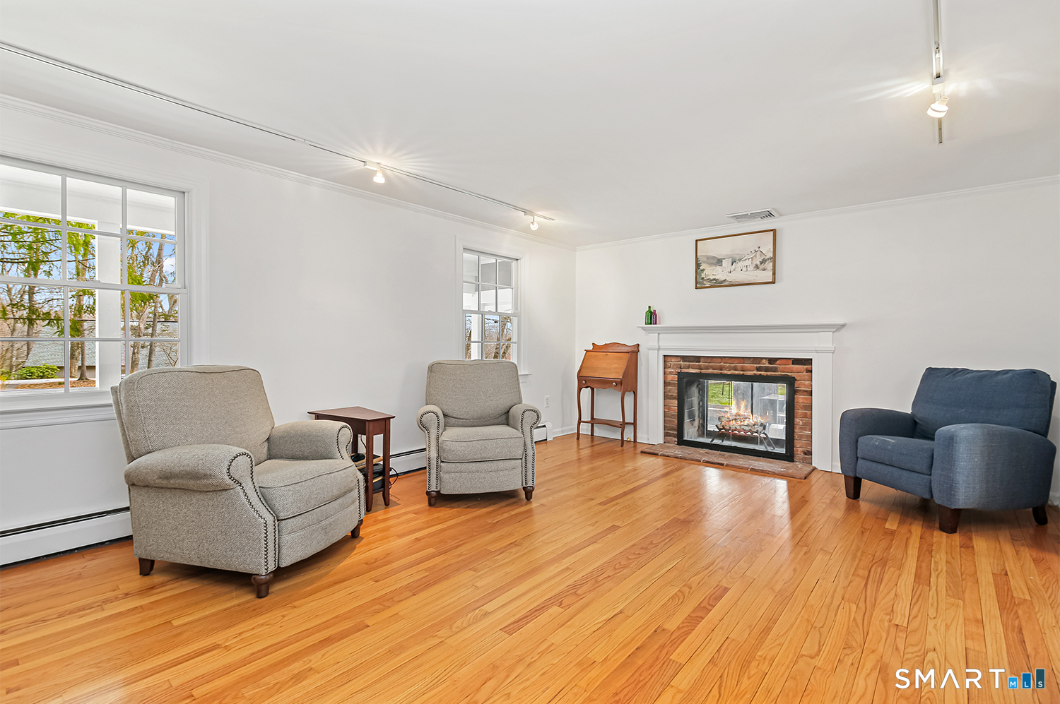 99 Chicken Street Wilton, CT 06897 - Photo 18 of 38 a living room with furniture and a fireplace