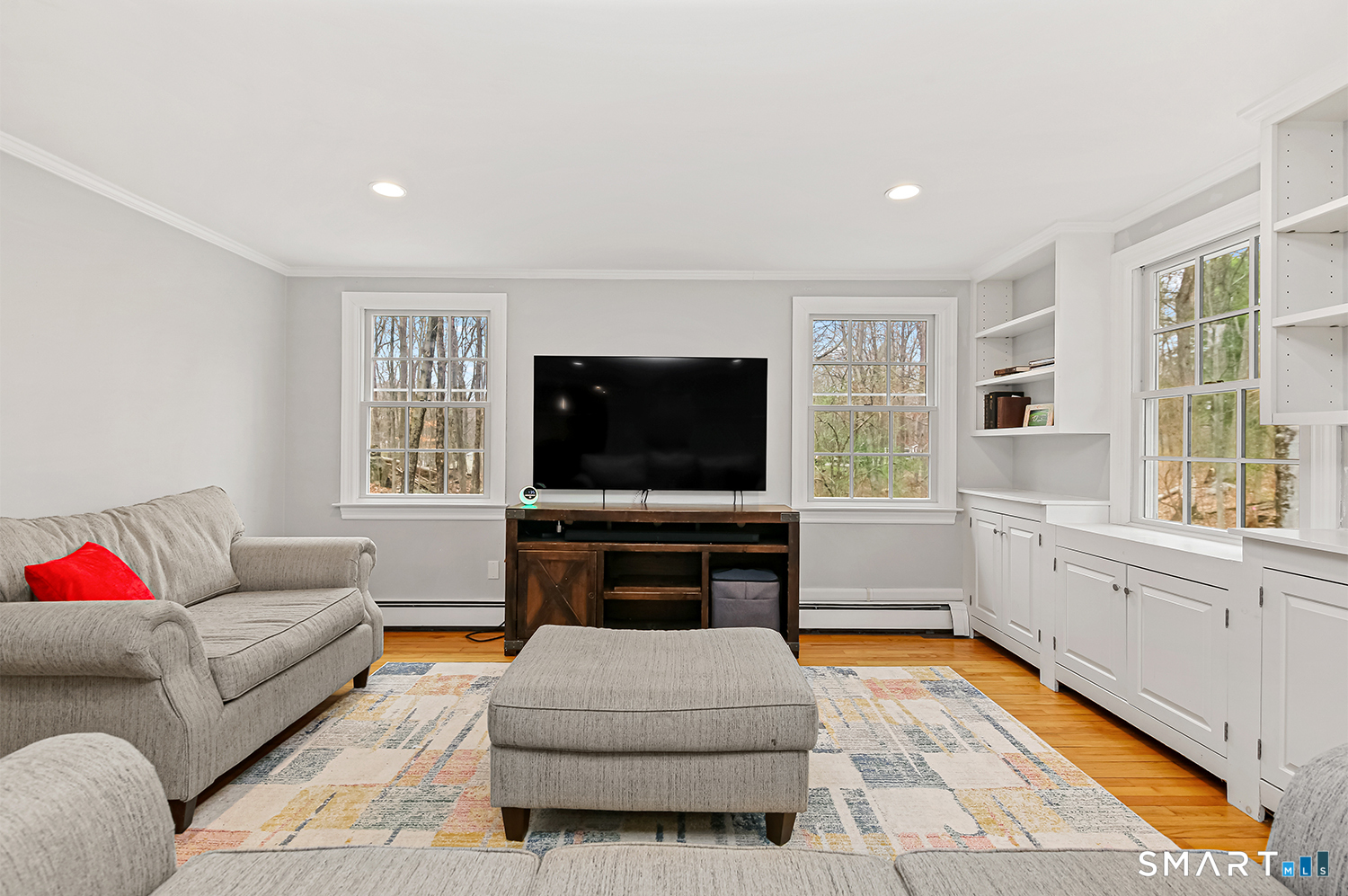 99 Chicken Street Wilton, CT 06897 - Photo 20 of 38 a living room with furniture and a flat screen tv