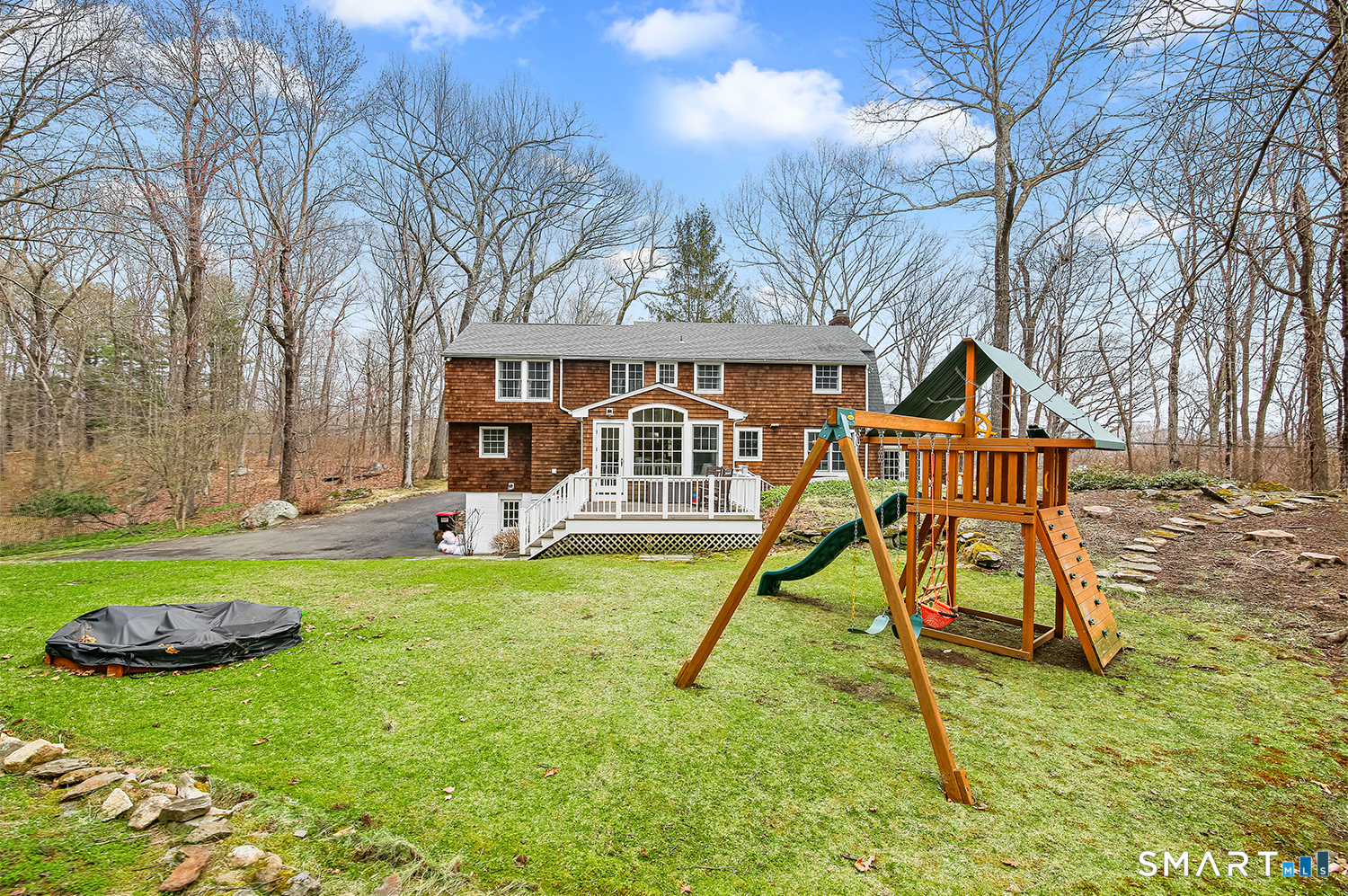 99 Chicken Street Wilton, CT 06897 - Photo 2 of 38 a view of a house with backyard and a slide