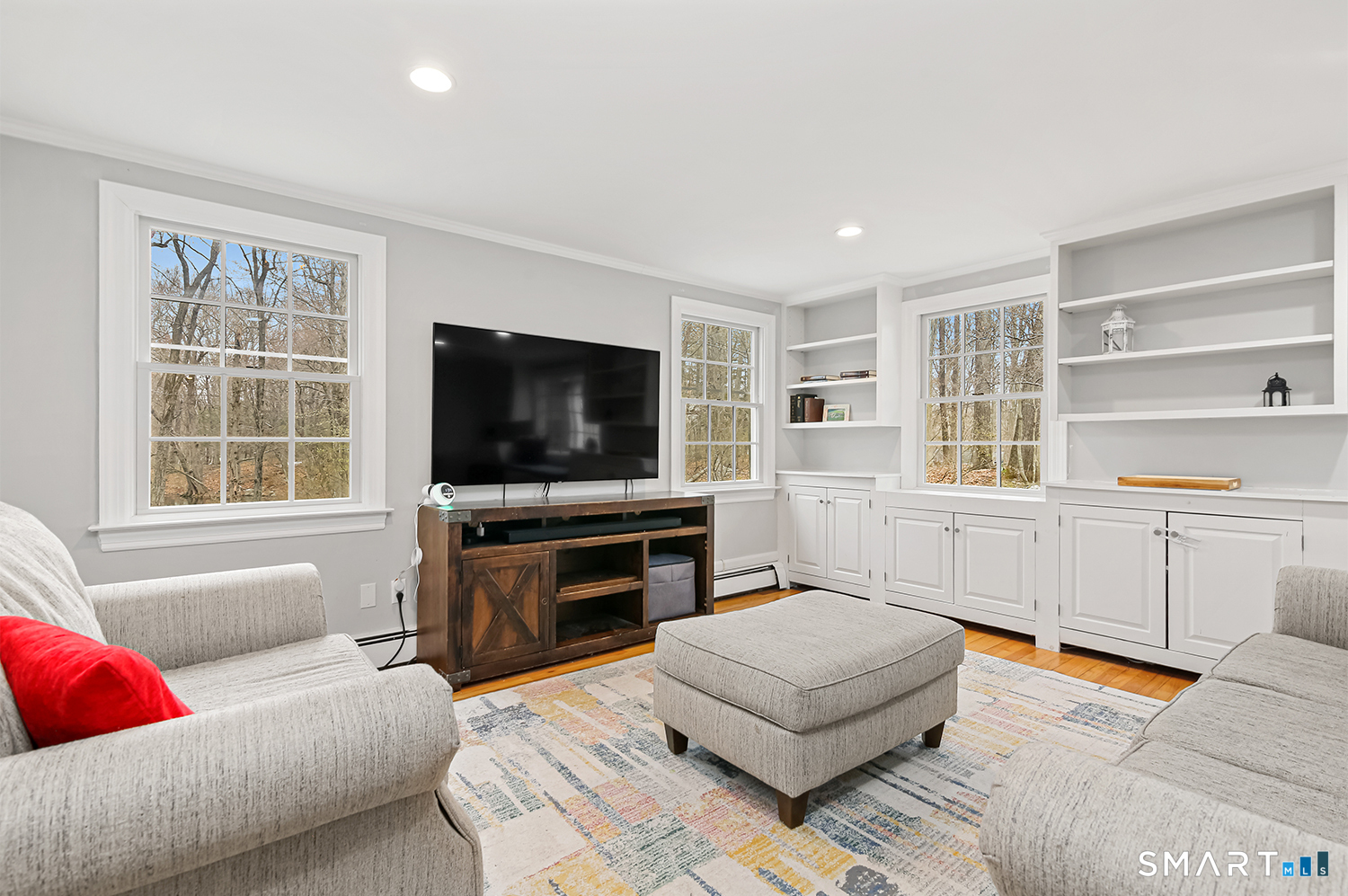 99 Chicken Street Wilton, CT 06897 - Photo 21 of 38 a living room with furniture and a flat screen tv