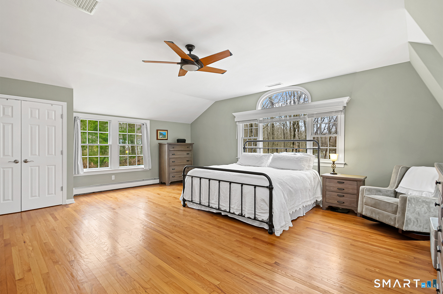99 Chicken Street Wilton, CT 06897 - Photo 23 of 38 a spacious bedroom with a bed and a large window