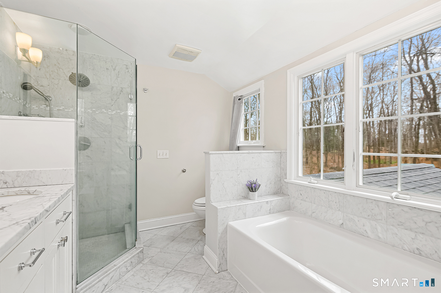 99 Chicken Street Wilton, CT 06897 - Photo 25 of 38 a bathroom with a granite countertop tub sink shower and mirror
