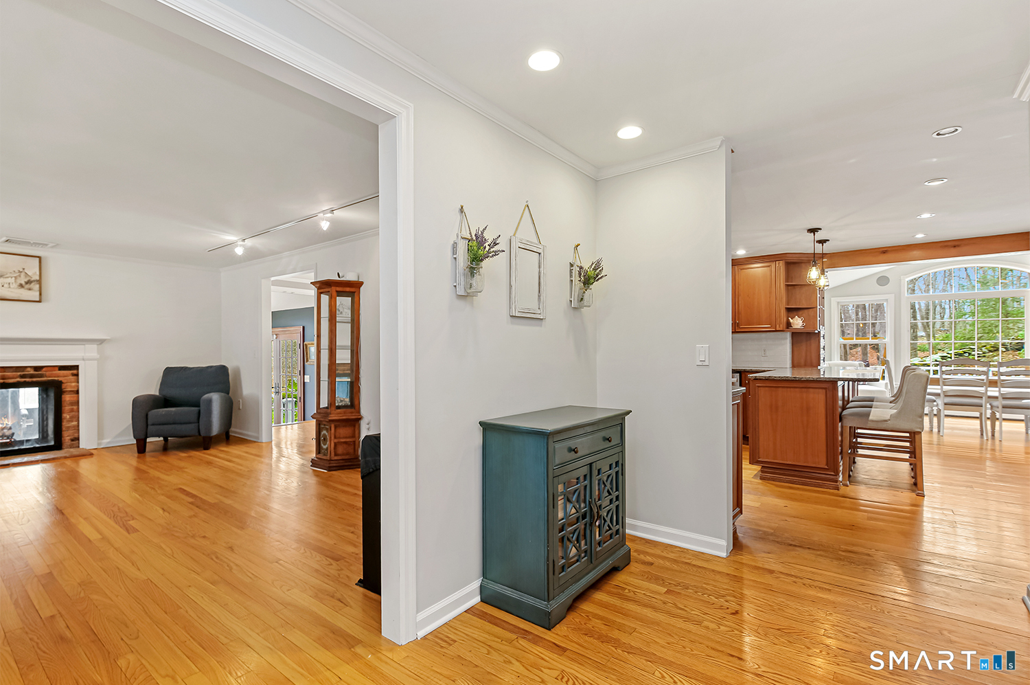 99 Chicken Street Wilton, CT 06897 - Photo 4 of 38 a view of livingroom with furniture staircase and kitchen view