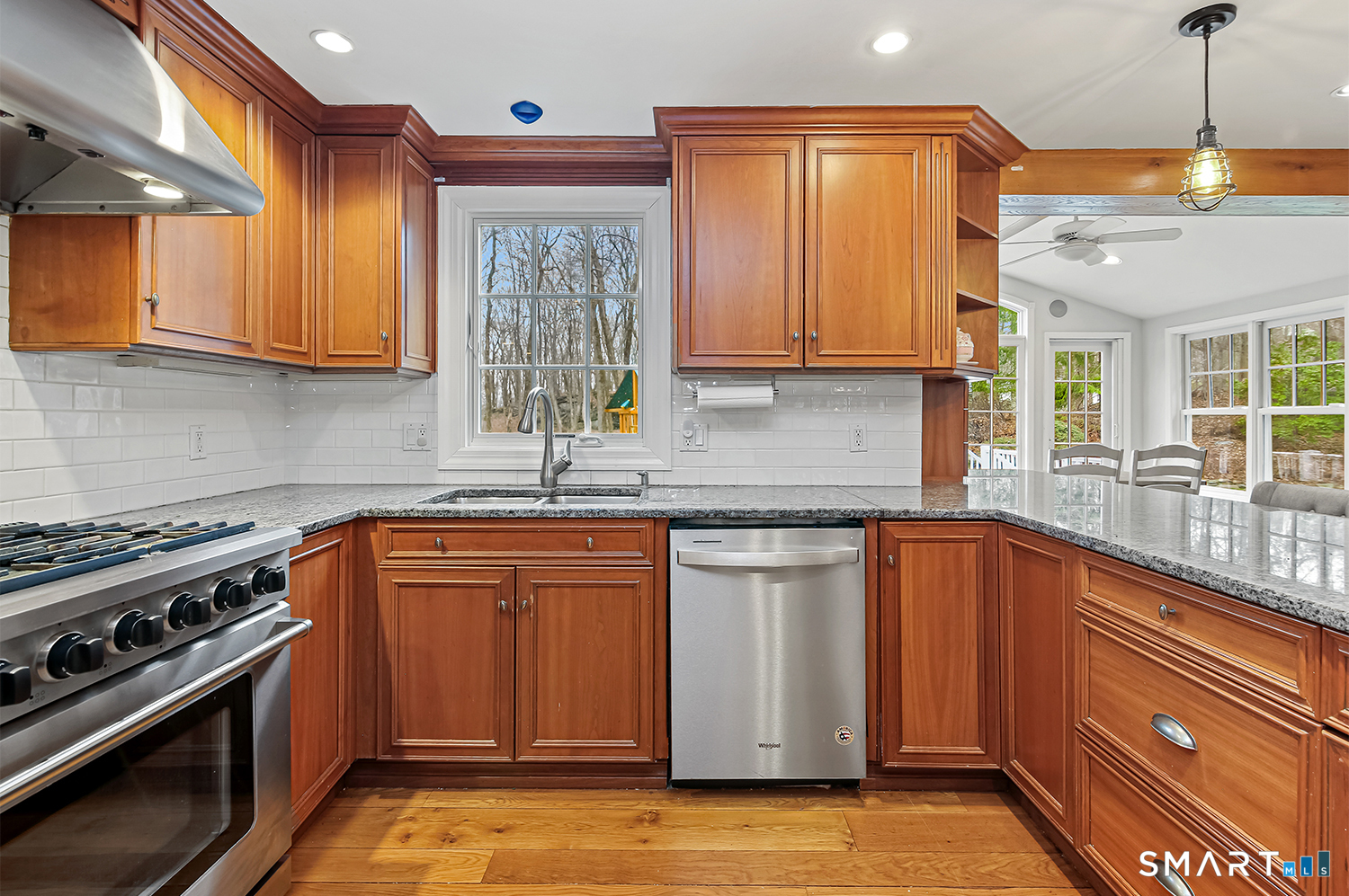 99 Chicken Street Wilton, CT 06897 - Photo 6 of 38 a kitchen with stainless steel appliances granite countertop a sink a stove and a refrigerator