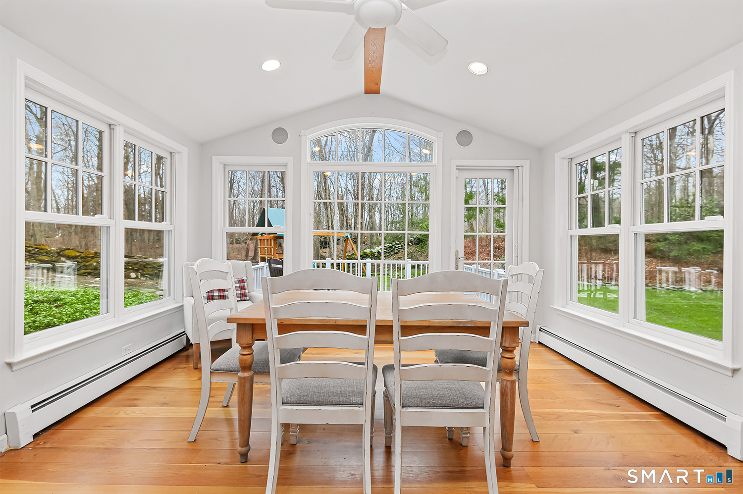 99 Chicken Street Wilton, CT 06897 - Photo 9 of 38 a dining room with wooden floor a chandelier