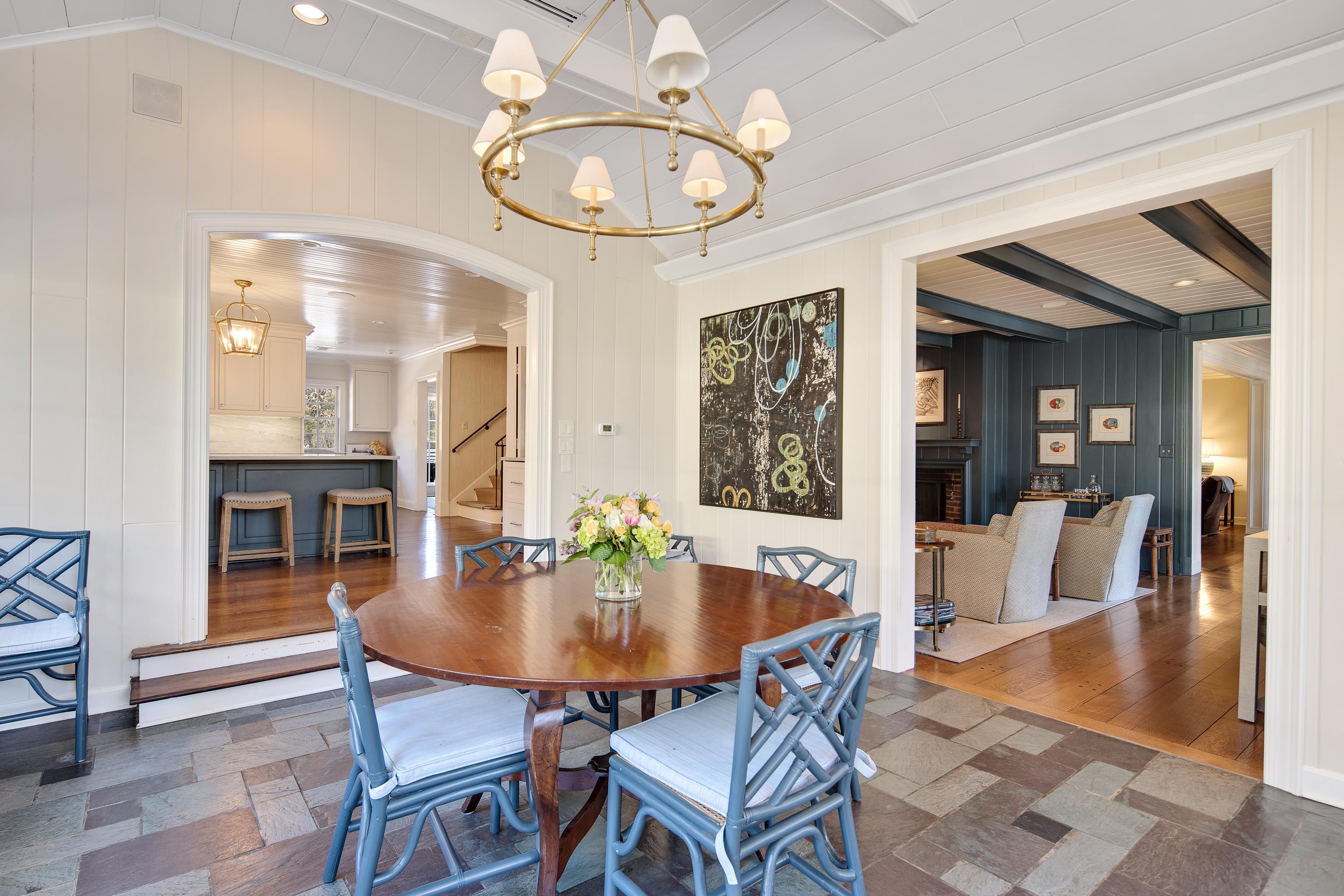 45 Norwal Road Memphis, TN 38117 - Photo 17 of 37 a dining room with wooden floor a chandelier a wooden table and chairs