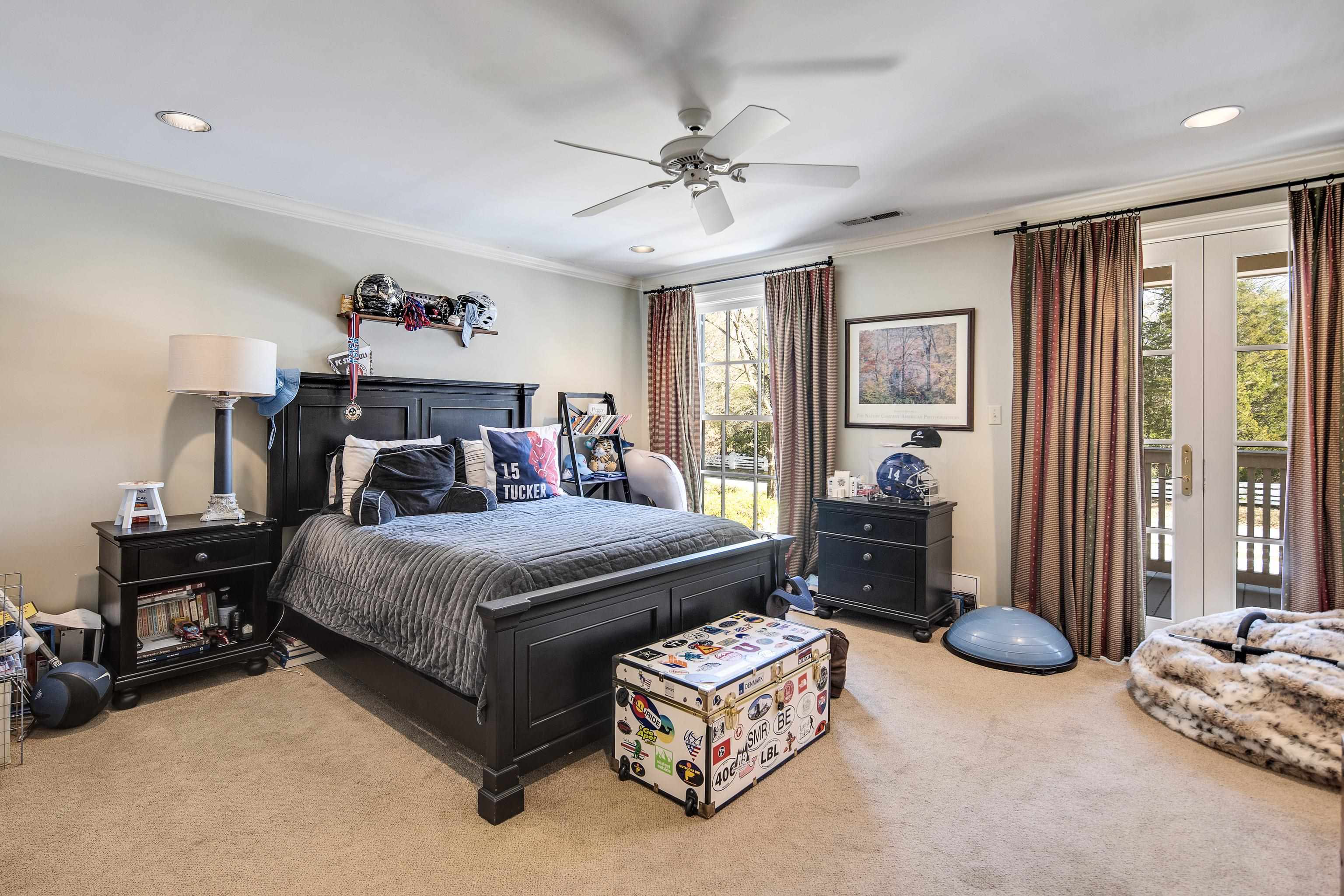 45 Norwal Road Memphis, TN 38117 - Photo 26 of 37 a bedroom with a bed and a chandelier