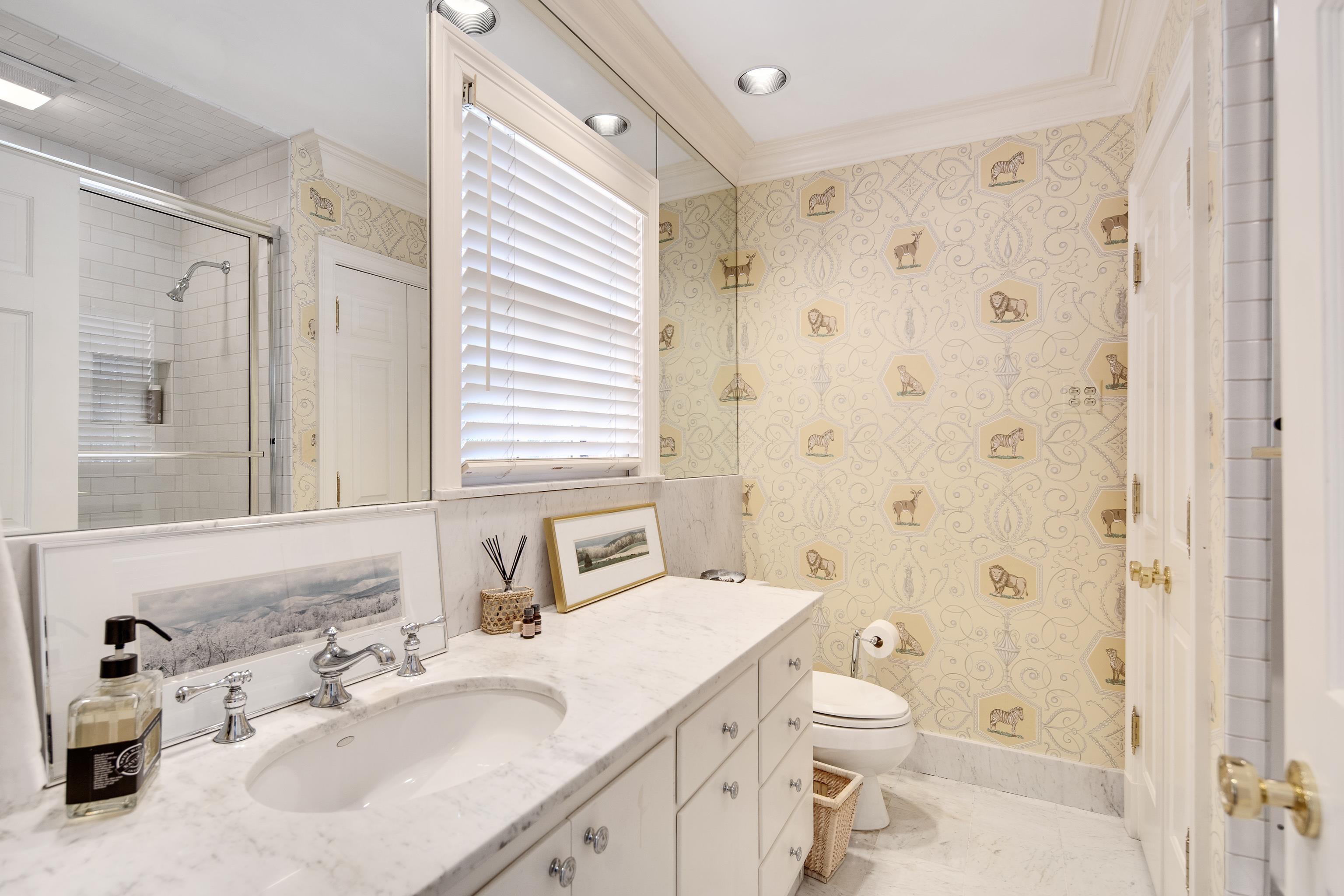 45 Norwal Road Memphis, TN 38117 - Photo 30 of 37 a bathroom with a sink a toilet and shower