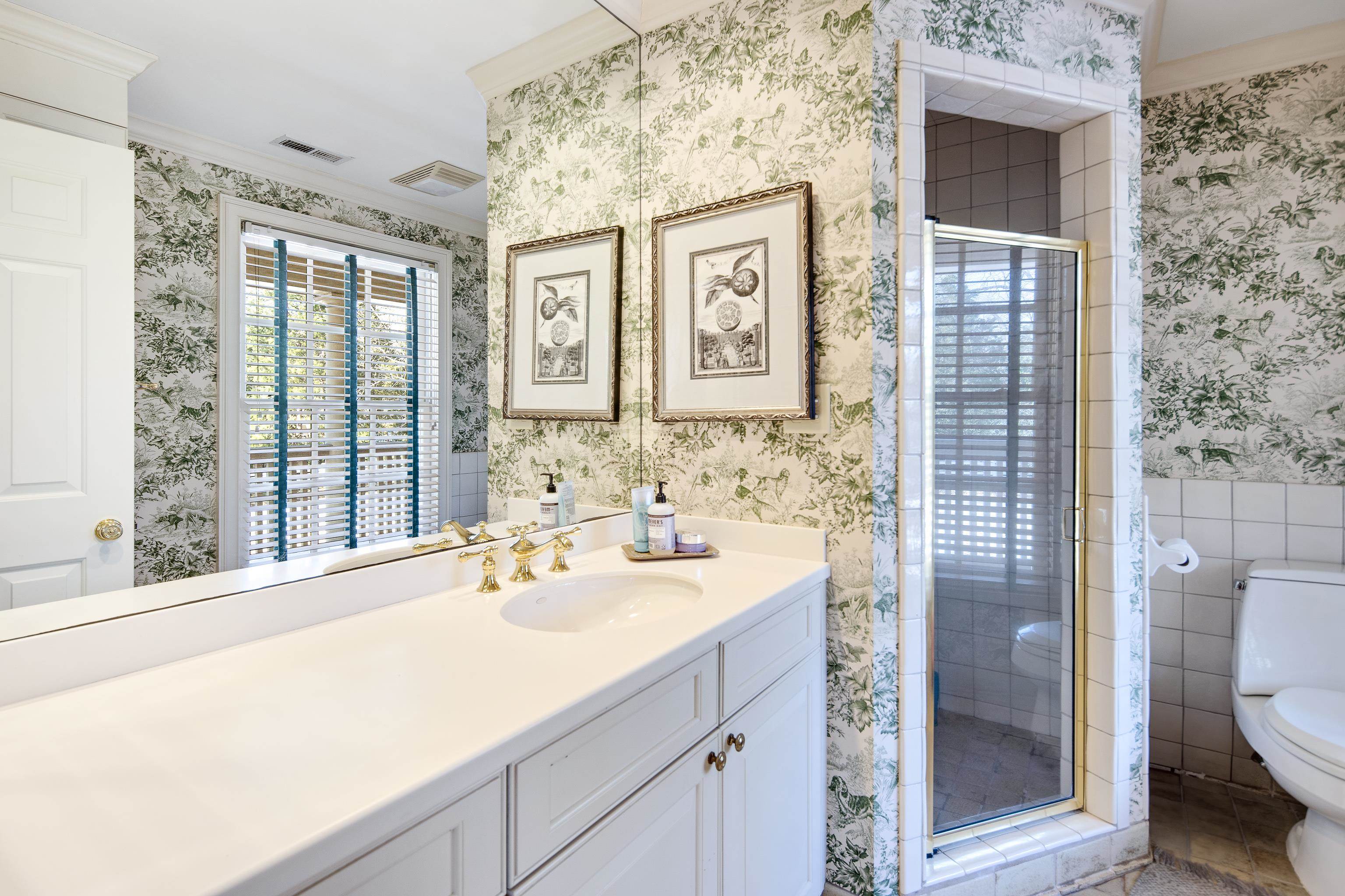 45 Norwal Road Memphis, TN 38117 - Photo 31 of 37 a bathroom with a sink a toilet and shower