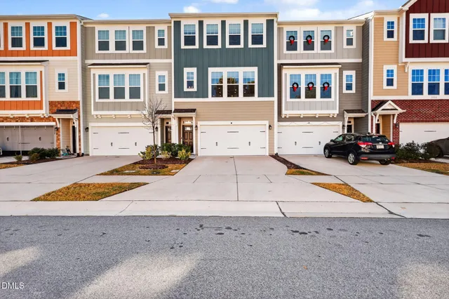 a view of a brick house with many windows
