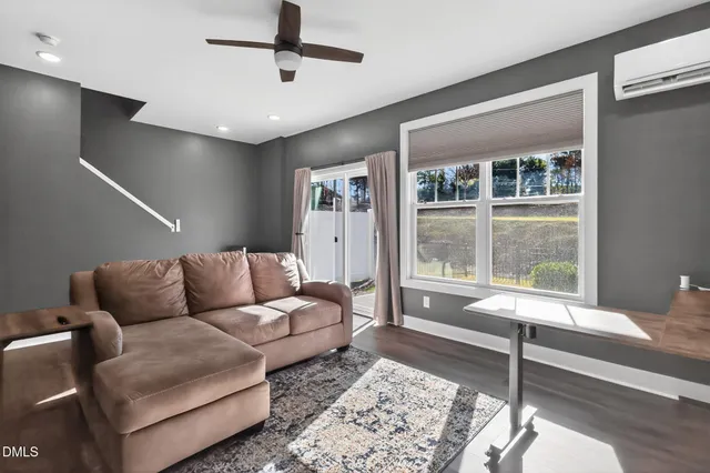 a living room with furniture and a window