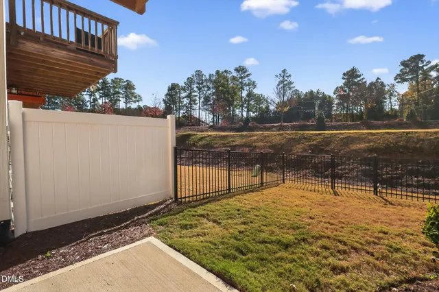 a view of a swimming pool with a yard