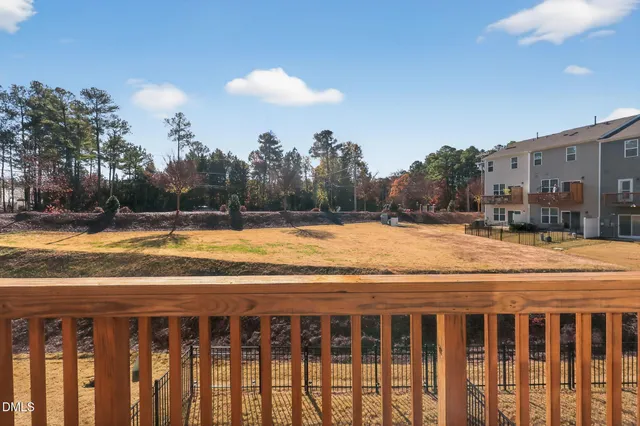 a view of balcony with wooden floor