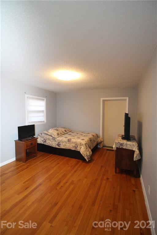 517 Rutledge Drive Catawba, SC 29704 - Photo 15 of 20 a bedroom with a bed and wooden floor