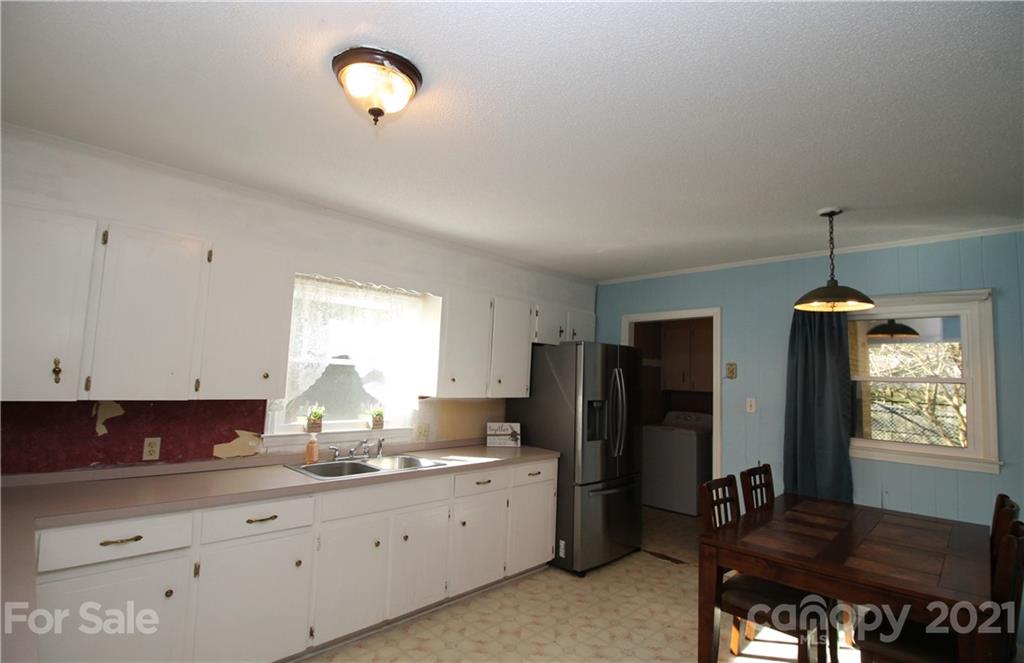 517 Rutledge Drive Catawba, SC 29704 - Photo 6 of 20 a kitchen with refrigerator and window