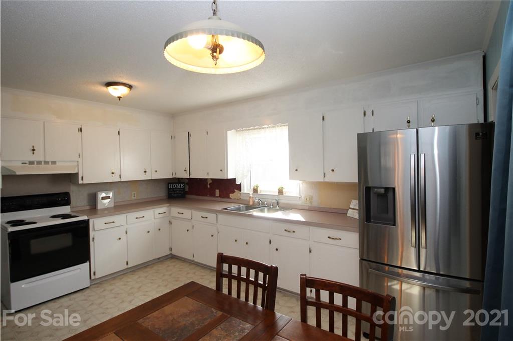 517 Rutledge Drive Catawba, SC 29704 - Photo 7 of 20 a kitchen with a sink stainless steel appliances and cabinets