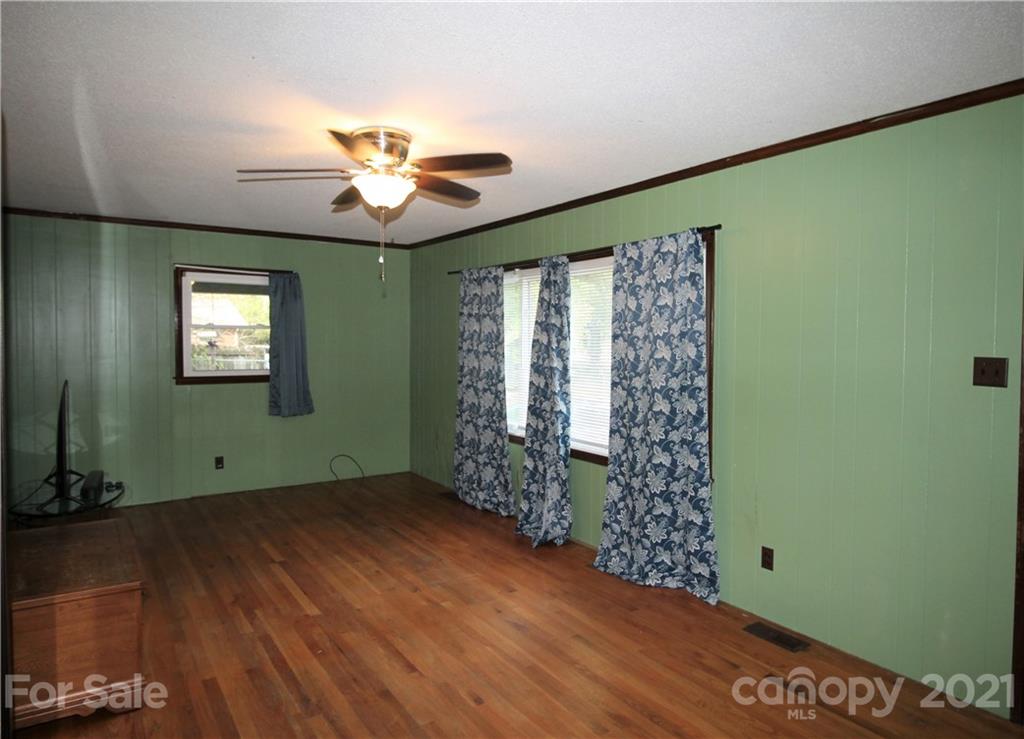 517 Rutledge Drive Catawba, SC 29704 - Photo 10 of 20 a view of an empty room with a window and wooden floor