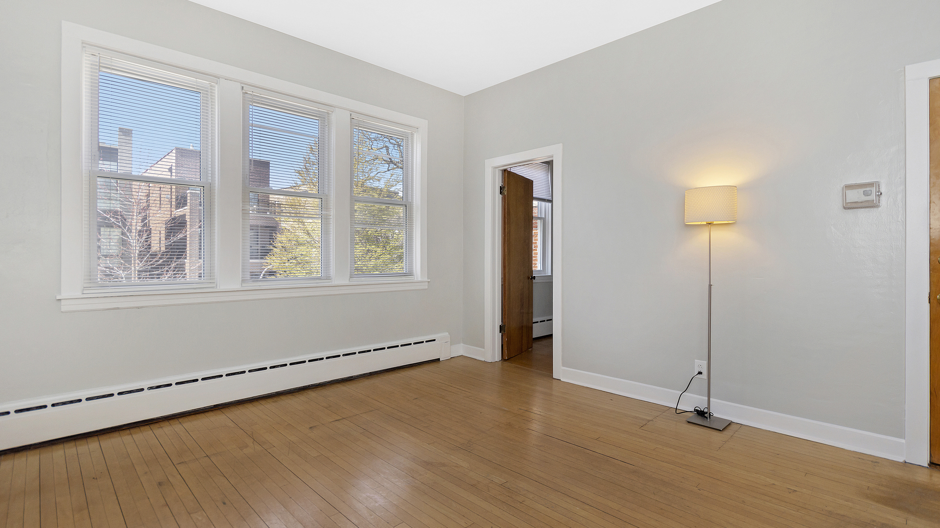 2905 North Burling Street, Unit 2 Chicago, IL 60657 - Photo 4 of 17 a view of an empty room with glass door