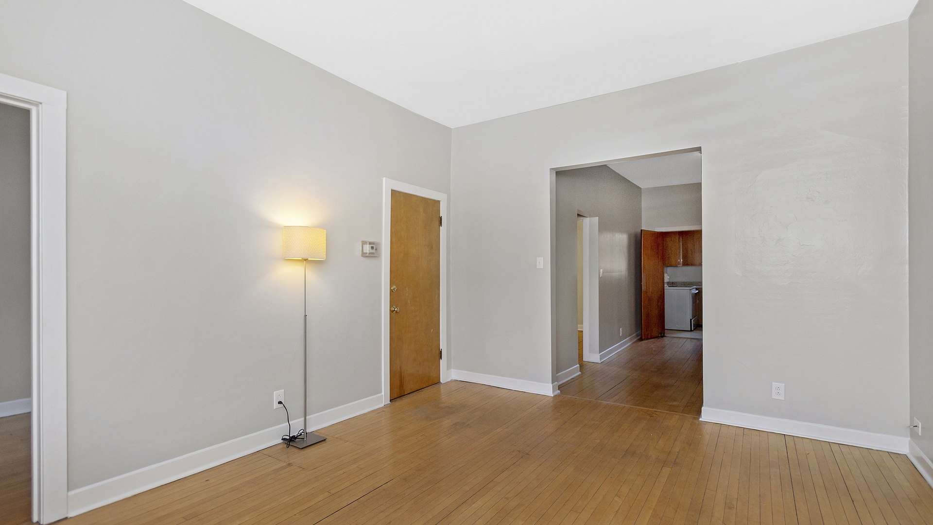 2905 North Burling Street, Unit 2 Chicago, IL 60657 - Photo 5 of 17 an empty room with wooden floor and entrance