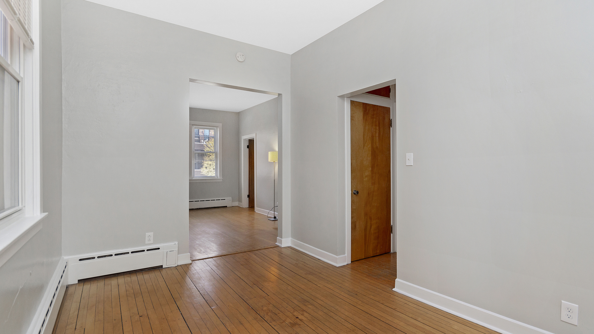 2905 North Burling Street, Unit 2 Chicago, IL 60657 - Photo 6 of 17 an empty room with wooden floor and closet