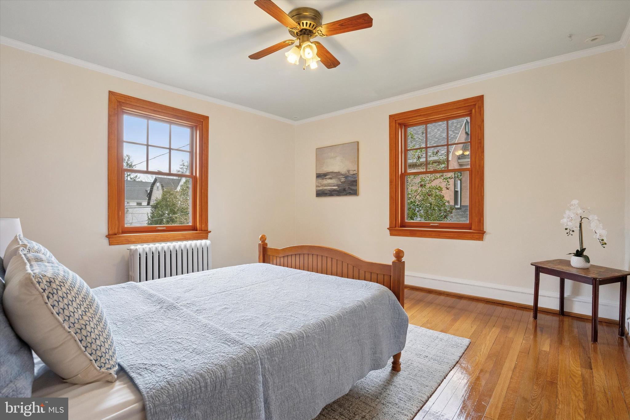 228 Avon Road Narberth, PA 19072 - Photo 16 of 24 a bedroom with a bed and wooden floor