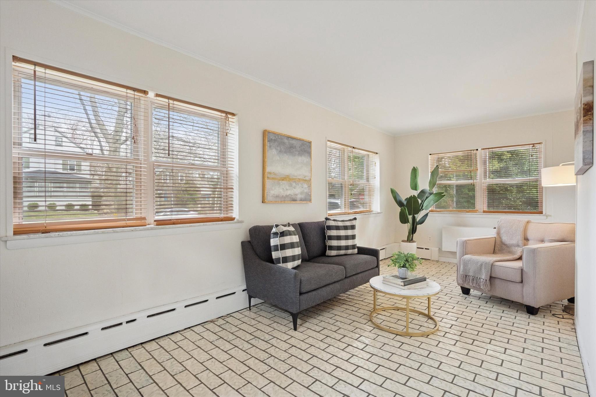 228 Avon Road Narberth, PA 19072 - Photo 7 of 24 a living room with furniture and a large window