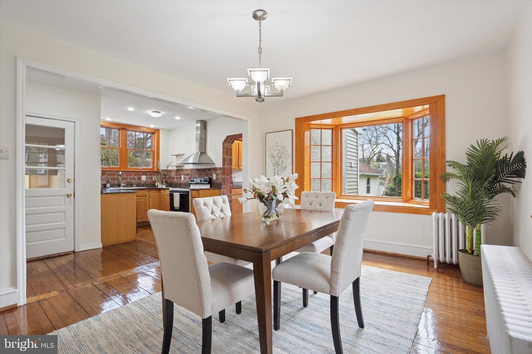 228 Avon Road Narberth, PA 19072 - Photo 8 of 24 a view of a dining room with furniture window and wooden floor