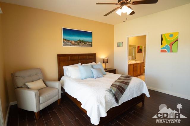 82320 Lancaster Way Indio, CA 92201 - Photo 11 of 27 a bedroom with a bed and a couch