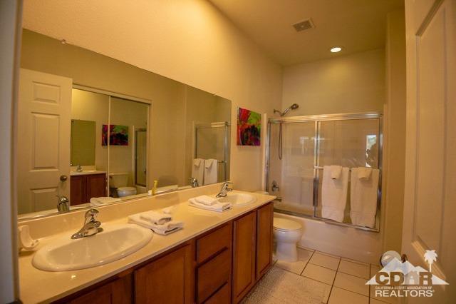 82320 Lancaster Way Indio, CA 92201 - Photo 12 of 27 a bathroom with a sink and a mirror