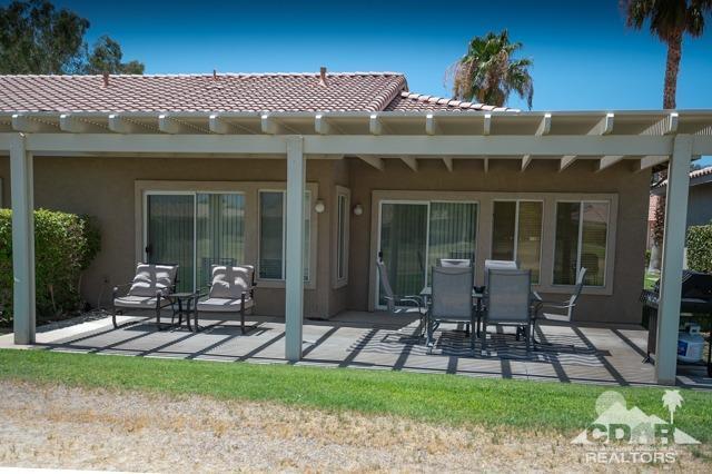 82320 Lancaster Way Indio, CA 92201 - Photo 16 of 27 a front view of house with a garden and patio