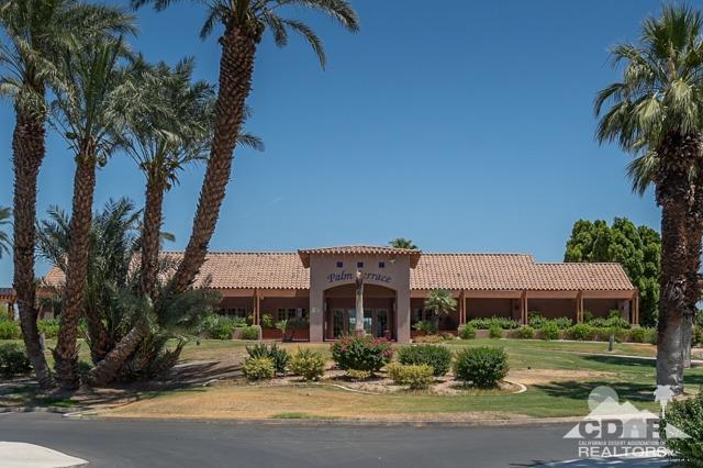 82320 Lancaster Way Indio, CA 92201 - Photo 18 of 27 a front view of a house with a garden
