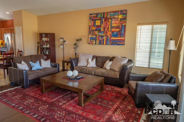 82320 Lancaster Way Indio, CA 92201 - Photo 4 of 27 a living room with furniture and a window