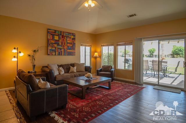 82320 Lancaster Way Indio, CA 92201 - Photo 5 of 27 a living room with furniture and a wooden floor