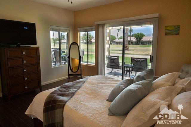 82320 Lancaster Way Indio, CA 92201 - Photo 10 of 27 a bedroom with a bed and a television